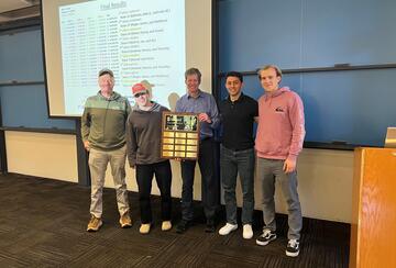 Group photo of winning team and professors